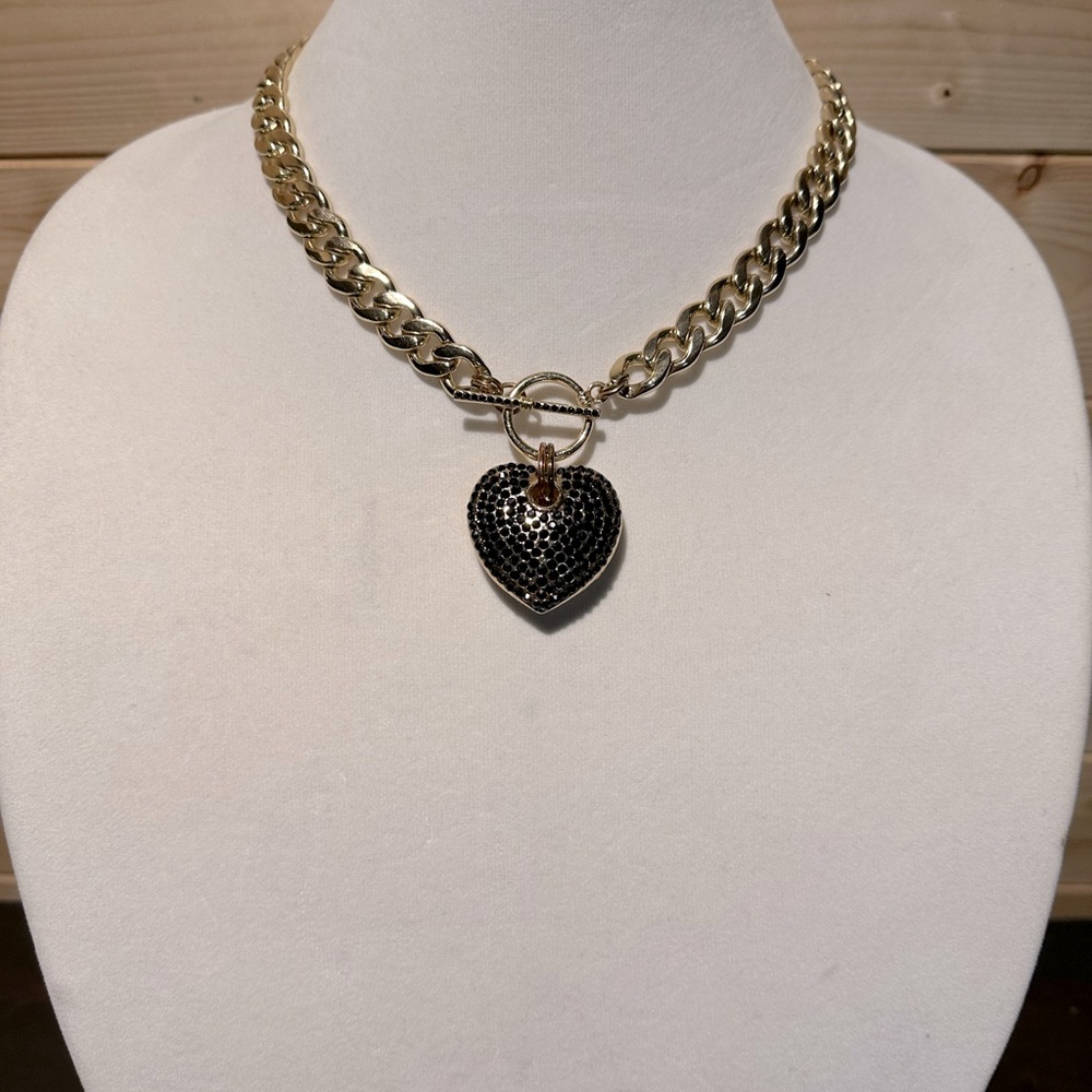 Beautiful heart necklace with black rhinestones and thick gold chain.